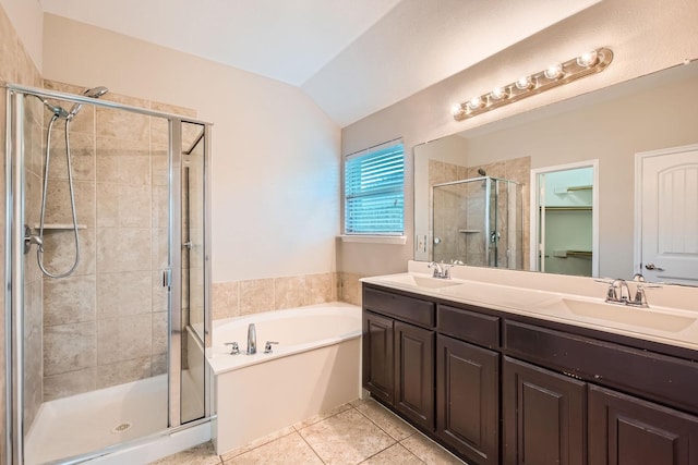 1119 Leafy Glade Rd, Forney, TX 75126 - full bath featuring a stall shower, a bath, double vanity, vaulted ceiling, and tile patterned flooring