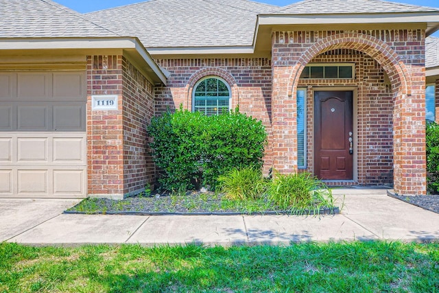 1119 Leafy Glade Rd, Forney, TX 75126 - property entrance featuring brick siding, a shingled roof, and an attached garage
