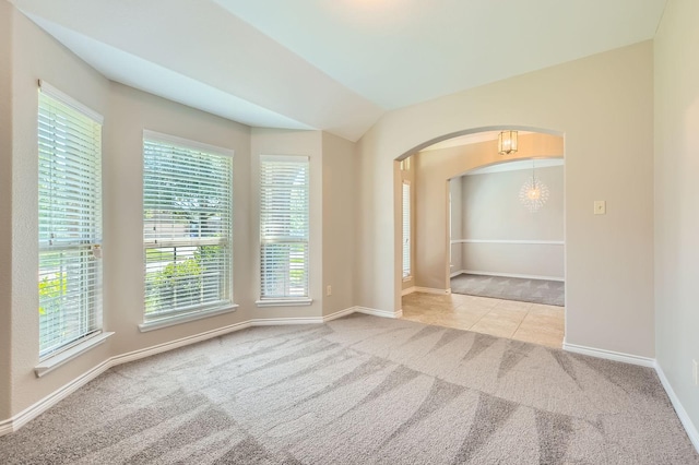 1119 Leafy Glade Rd, Forney, TX 75126 - carpeted spare room featuring a chandelier, arched walkways, and plenty of natural light