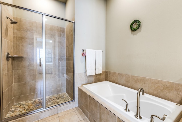 7333 Valley View Ln Unit 304, Dallas, TX 75240 - full bath with a bath, a shower stall, and tile patterned flooring