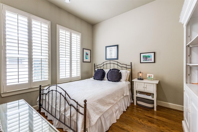 7333 Valley View Ln Unit 304, Dallas, TX 75240 - bedroom with wood finished floors and baseboards