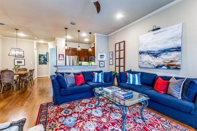 7333 Valley View Ln Unit 304, Dallas, TX 75240 - living room with wood finished floors, ornamental molding, recessed lighting, and a chandelier