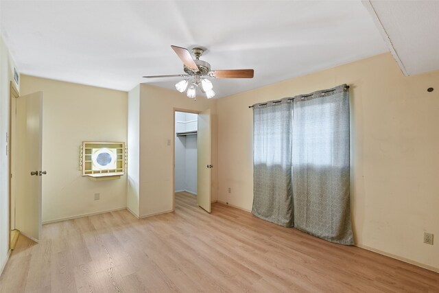 921 Sleepy Hollow Dr, Garland, TX 75043 - unfurnished bedroom featuring light wood-type flooring and a ceiling fan