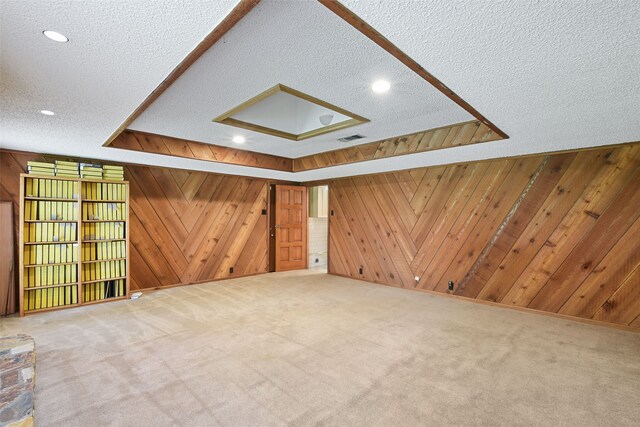 921 Sleepy Hollow Dr, Garland, TX 75043 - unfurnished living room with wooden walls, a textured ceiling, carpet flooring, and recessed lighting