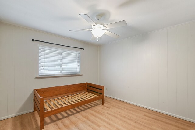 921 Sleepy Hollow Dr, Garland, TX 75043 - bedroom featuring wood finished floors and a ceiling fan