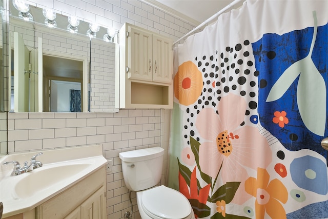 921 Sleepy Hollow Dr, Garland, TX 75043 - bathroom featuring tile walls, vanity, and a shower with shower curtain