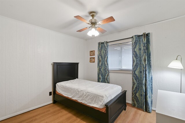 921 Sleepy Hollow Dr, Garland, TX 75043 - bedroom with light wood finished floors and ceiling fan