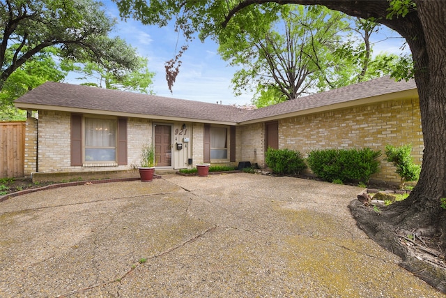 921 Sleepy Hollow Dr, Garland, TX 75043 - ranch-style home with brick siding, a patio, and roof with shingles