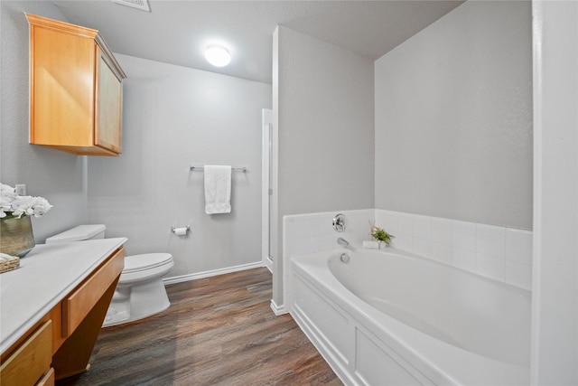 1617 Brookstone Dr, Little Elm, TX 75068 - full bathroom featuring a garden tub, wood finished floors, and vanity