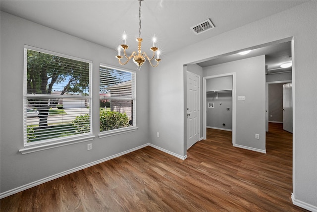 1617 Brookstone Dr, Little Elm, TX 75068 - unfurnished dining area with a chandelier and wood finished floors