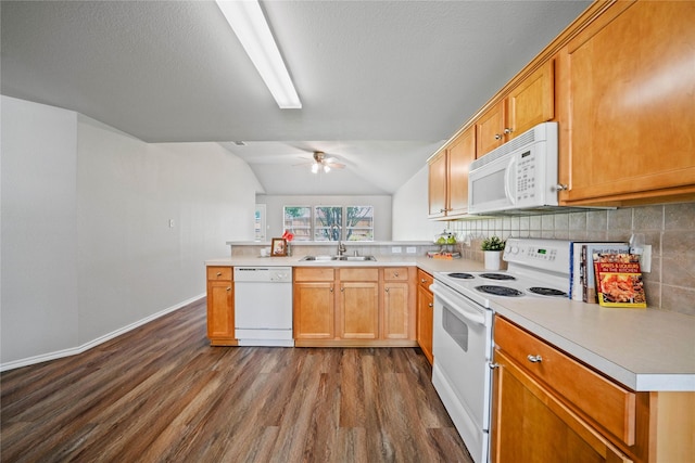 1617 Brookstone Dr, Little Elm, TX 75068 - kitchen featuring white appliances, dark wood-style floors, a peninsula, decorative backsplash, and light countertops