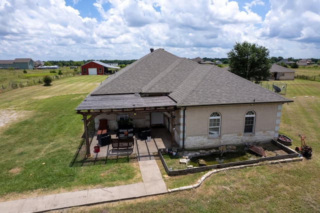 2210 N Sky Meadows Dr, Caddo Mills, TX 75135 - view of front facade featuring roof with shingles, a patio area, a front lawn, brick siding, and an outdoor living space
