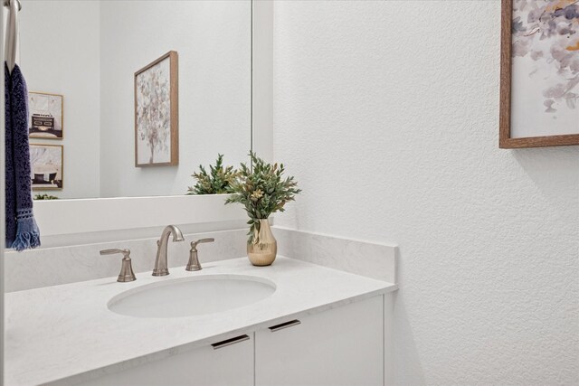 8305 Caballo Dr, North Richland Hills, TX 76182 - bathroom with vanity and a textured wall