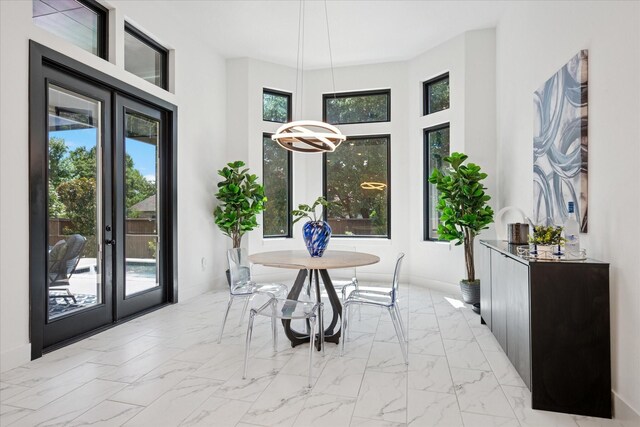 8305 Caballo Dr, North Richland Hills, TX 76182 - dining area with french doors and light marble finish flooring