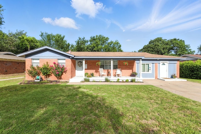 1037 Cavender Dr, Hurst, TX 76053 - ranch-style house featuring brick siding, a porch, and a front lawn