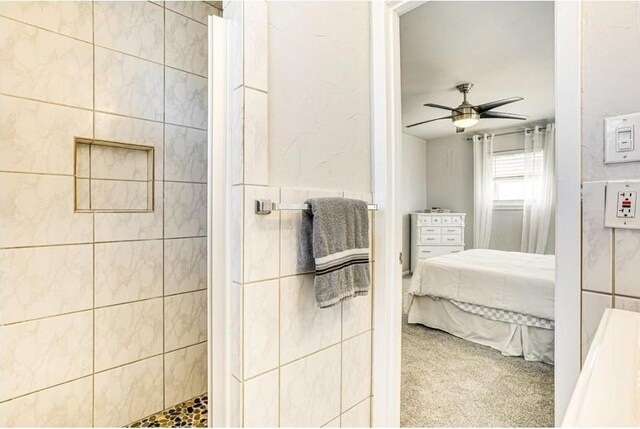 1037 Cavender Dr, Hurst, TX 76053 - ensuite bathroom featuring tiled shower and ceiling fan
