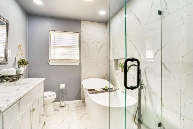 1037 Cavender Dr, Hurst, TX 76053 - bathroom featuring marble finish flooring, vanity, healthy amount of natural light, a soaking tub, and recessed lighting
