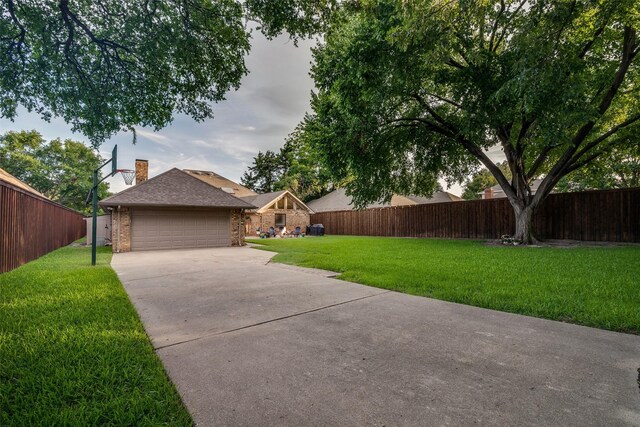 1509 Banbury Ct, Richardson, TX 75082 - view of front of property with driveway, brick siding, a chimney, and roof with shingles