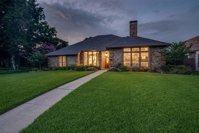 1509 Banbury Ct, Richardson, TX 75082 - view of front of property featuring brick siding, a chimney, a lawn, and roof with shingles