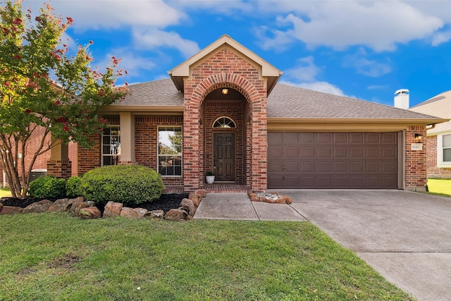 8648 Marion Dr, Frisco, TX 75036 - traditional-style house featuring an attached garage, brick siding, concrete driveway, and a front lawn