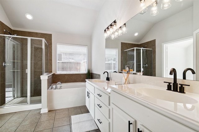 8648 Marion Dr, Frisco, TX 75036 - full bath featuring lofted ceiling, double vanity, a stall shower, a garden tub, and tile patterned floors