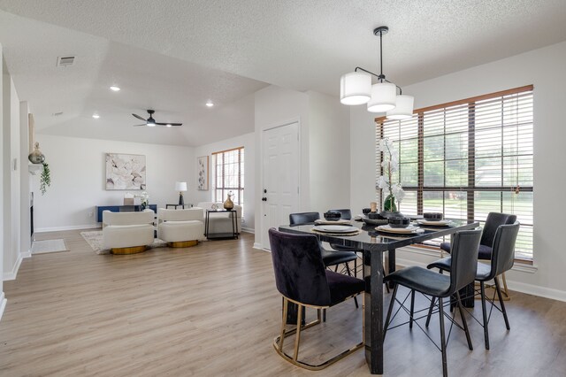 2508 Independence Dr, Mesquite, TX 75150 - dining room featuring light wood-style floors, recessed lighting, a ceiling fan, a textured ceiling, and vaulted ceiling