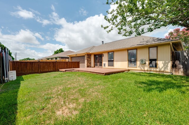 2508 Independence Dr, Mesquite, TX 75150 - rear view of property featuring a fenced backyard, an attached garage, a deck, and roof with shingles