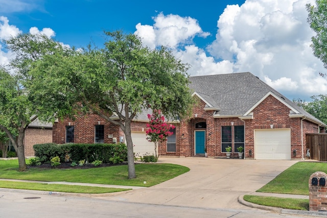 134 Fox Hollow Blvd, Forney, TX 75126 - view of front facade featuring concrete driveway, brick siding, roof with shingles, a front lawn, and an attached garage