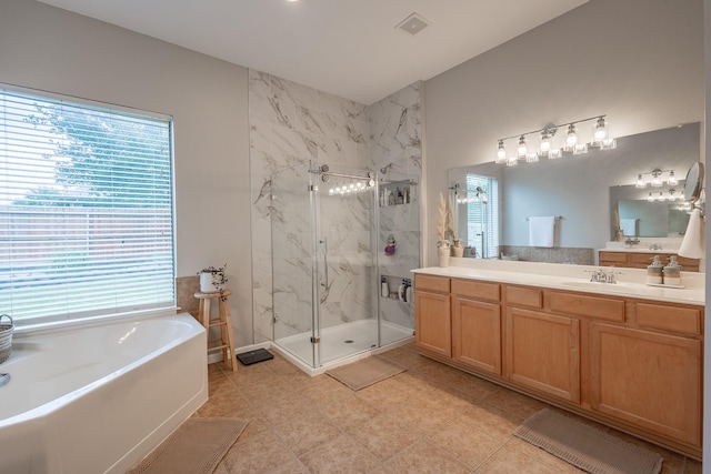134 Fox Hollow Blvd, Forney, TX 75126 - bathroom featuring a marble finish shower, vanity, a bath, and tile patterned flooring
