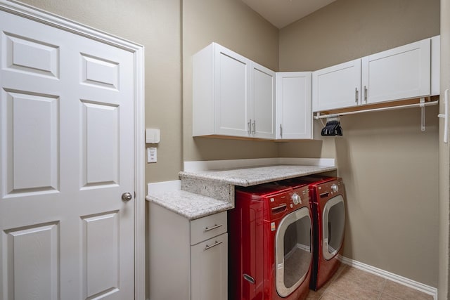 134 Fox Hollow Blvd, Forney, TX 75126 - washroom featuring washer and dryer, cabinet space, and light tile patterned floors