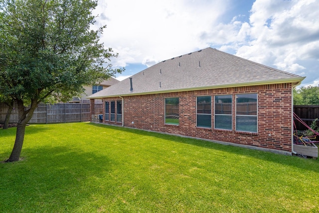 134 Fox Hollow Blvd, Forney, TX 75126 - back of property with a shingled roof and brick siding