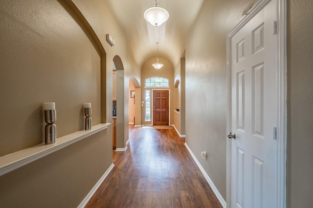 134 Fox Hollow Blvd, Forney, TX 75126 - entryway with arched walkways, dark wood-style floors, and lofted ceiling