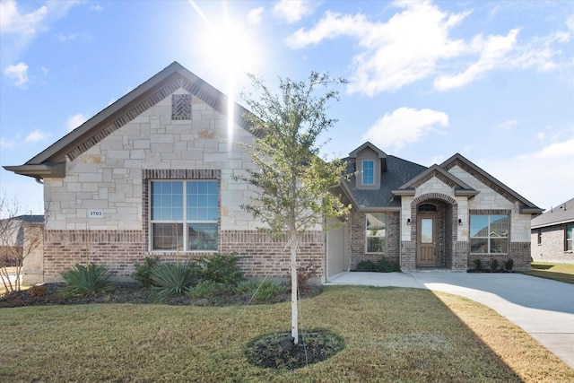 3703 Twin Pines Dr, Grand Prairie, TX 76065 - french country inspired facade with brick siding, a front yard, and stone siding