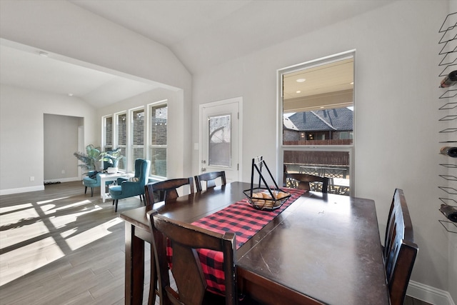 3703 Twin Pines Dr, Grand Prairie, TX 76065 - dining room featuring vaulted ceiling and wood finished floors
