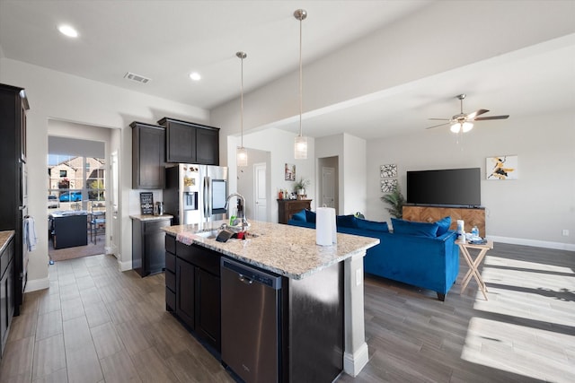 3703 Twin Pines Dr, Grand Prairie, TX 76065 - kitchen with stainless steel appliances, a center island with sink, ceiling fan, wood finished floors, and recessed lighting