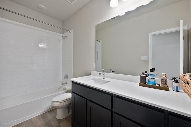 3703 Twin Pines Dr, Grand Prairie, TX 76065 - full bathroom featuring wood finished floors, vanity, and shower / tub combination