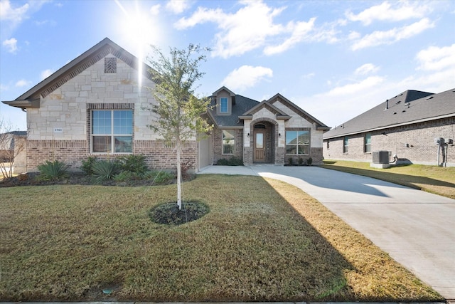 3703 Twin Pines Dr, Grand Prairie, TX 76065 - view of front of property featuring concrete driveway, brick siding, and a front yard