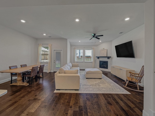 1701 Briar Hill Dr, Denton, TX 76207 - living room with a ceiling fan, dark wood-type flooring, a glass covered fireplace, and recessed lighting