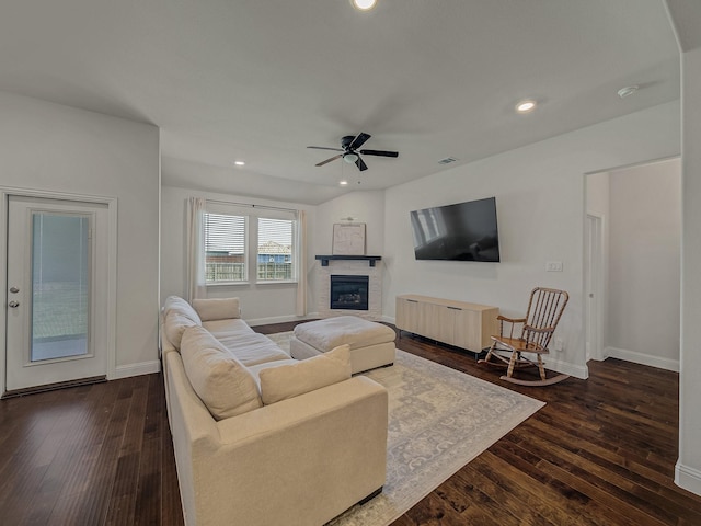 1701 Briar Hill Dr, Denton, TX 76207 - living area with a ceiling fan, dark wood finished floors, a glass covered fireplace, and recessed lighting