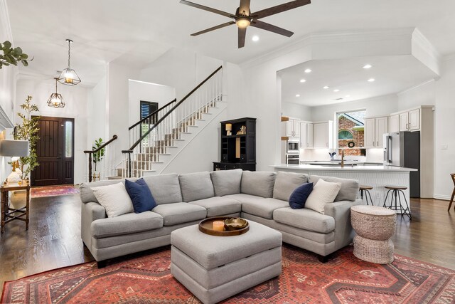 406 Old York Rd, Coppell, TX 75019 - living area featuring dark wood-style flooring, stairs, recessed lighting, a ceiling fan, and ornamental molding