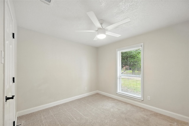 3505 Scott Dr, Rowlett, TX 75088 - empty room with ceiling fan, light colored carpet, and a textured ceiling