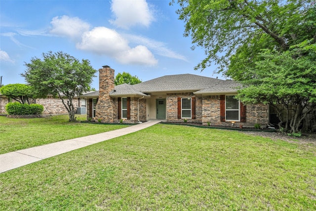 3505 Scott Dr, Rowlett, TX 75088 - view of front facade featuring a front yard, a chimney, and a shingled roof