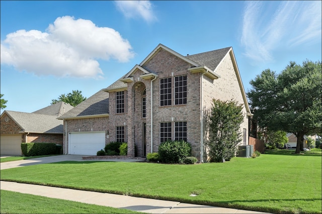 1604 Tree Line Rd, Flower Mound, TX 75028 - view of front of home featuring brick siding, a front lawn, and concrete driveway