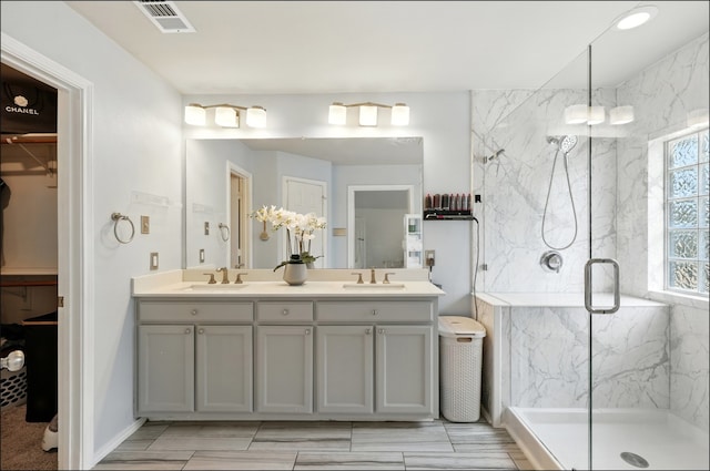 1604 Tree Line Rd, Flower Mound, TX 75028 - bathroom with double vanity, a marble finish shower, and a spacious closet