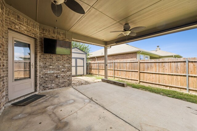 1012 Rising Moon Dr, Fort Worth, TX 76052 - fenced backyard featuring ceiling fan, a shed, and a patio