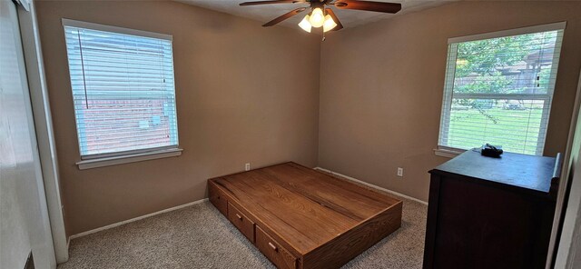 1747 Lucille Dr, Mesquite, TX 75149 - carpeted bedroom with multiple windows and ceiling fan