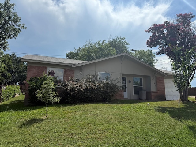 1747 Lucille Dr, Mesquite, TX 75149 - single story home with brick siding, an attached garage, and a front lawn