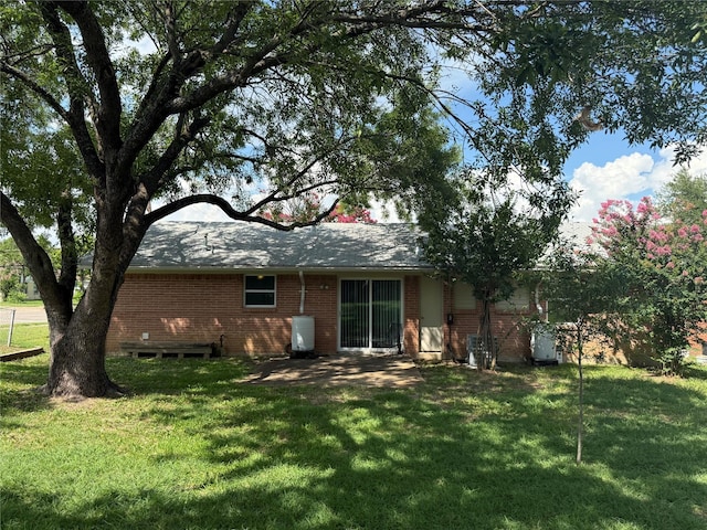 1747 Lucille Dr, Mesquite, TX 75149 - back of property with brick siding and a yard