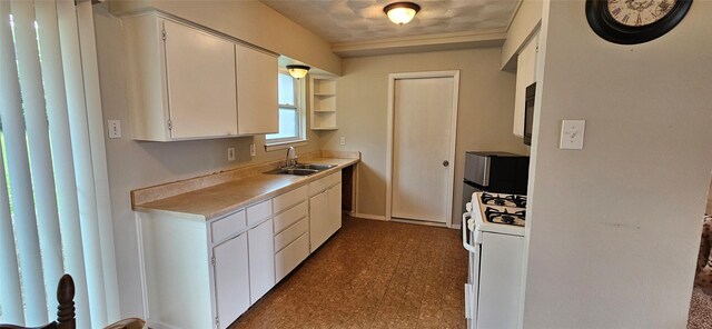 1747 Lucille Dr, Mesquite, TX 75149 - kitchen featuring white range with gas cooktop, light countertops, white cabinets, open shelves, and dark flooring