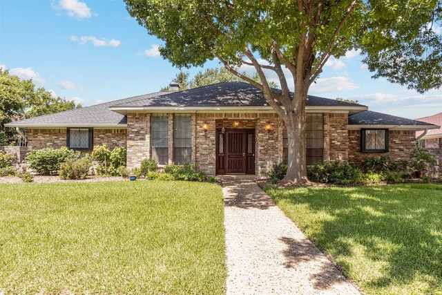 10009 Apple Creek Dr, Dallas, TX 75243 - view of front of house with a front lawn, brick siding, and roof with shingles